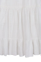 Embroidered white V neckline tiered dress